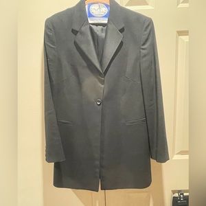 Woman’s tuxedo black suit. Very classy and elegant. By Byblos Italian designer.